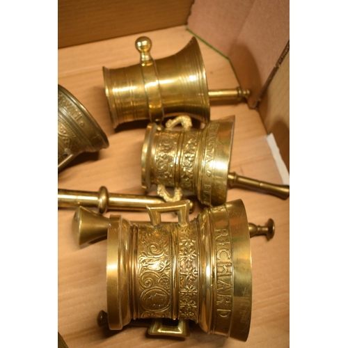 425 - A good collection of cast brass mortar and pestles of varying ages together with an oriental brass i... 