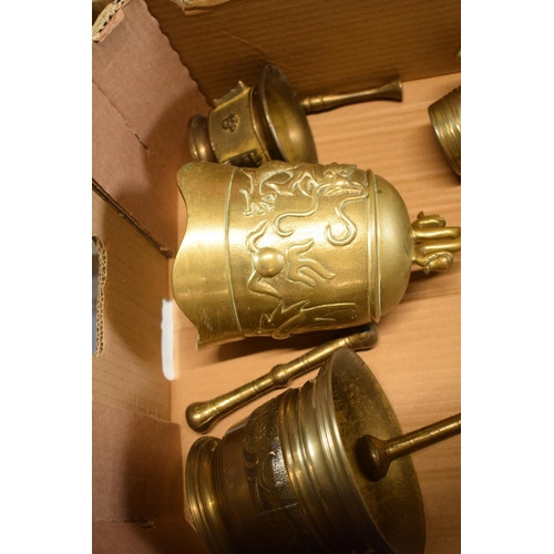 425 - A good collection of cast brass mortar and pestles of varying ages together with an oriental brass i... 