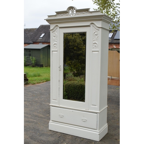 428 - A painted white wooden Edwardian wardrobe with carved decoration and mirrored door. 115 x 54 x 227cm... 