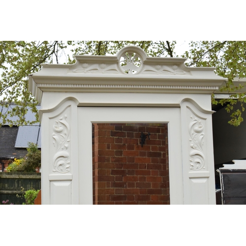 428 - A painted white wooden Edwardian wardrobe with carved decoration and mirrored door. 115 x 54 x 227cm... 