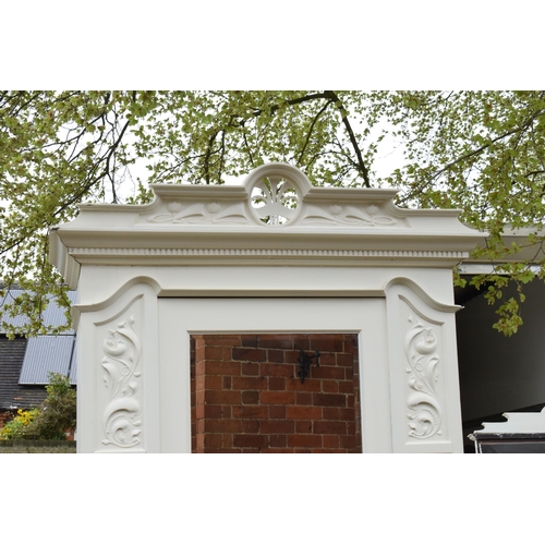 428 - A painted white wooden Edwardian wardrobe with carved decoration and mirrored door. 115 x 54 x 227cm... 