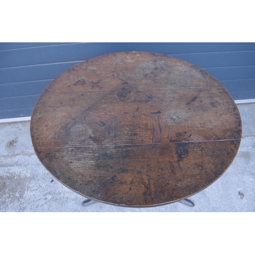 430 - A 19th century oak tripod table with circular top on a column. 96 x 53 x 86cm tall. In good conditio... 