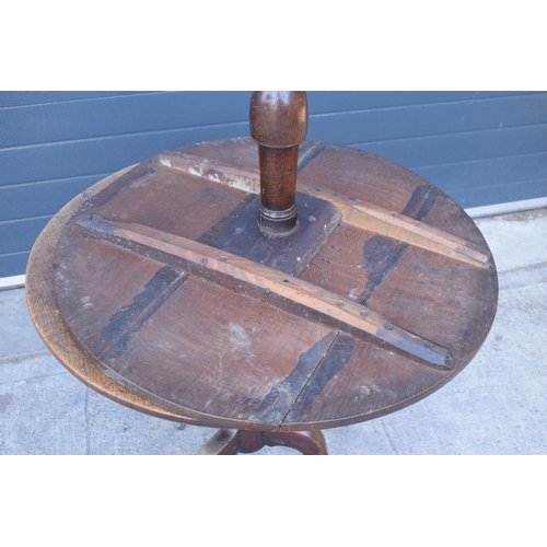 430 - A 19th century oak tripod table with circular top on a column. 96 x 53 x 86cm tall. In good conditio... 