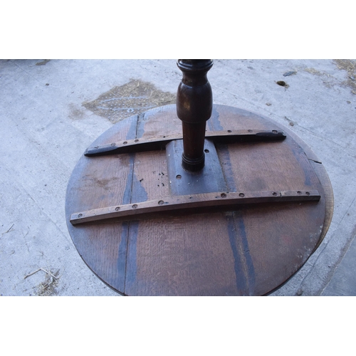 430 - A 19th century oak tripod table with circular top on a column. 96 x 53 x 86cm tall. In good conditio... 