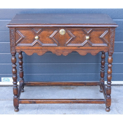 431 - A late 19th century / early 20th century oak side table with single frieze drawer and carved decorat... 