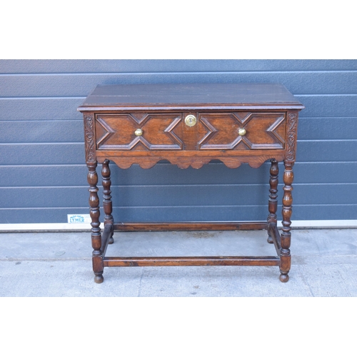 431 - A late 19th century / early 20th century oak side table with single frieze drawer and carved decorat... 