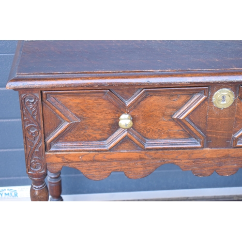 431 - A late 19th century / early 20th century oak side table with single frieze drawer and carved decorat... 