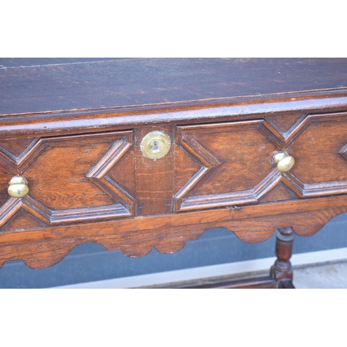 431 - A late 19th century / early 20th century oak side table with single frieze drawer and carved decorat... 