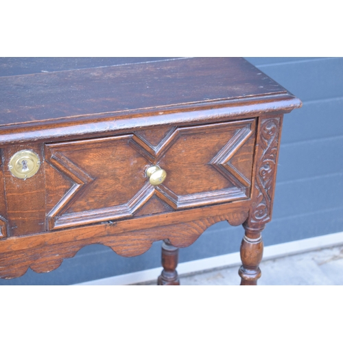 431 - A late 19th century / early 20th century oak side table with single frieze drawer and carved decorat... 