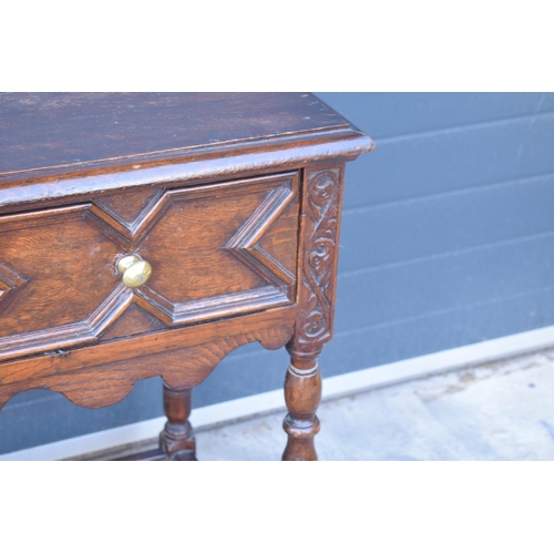 431 - A late 19th century / early 20th century oak side table with single frieze drawer and carved decorat... 