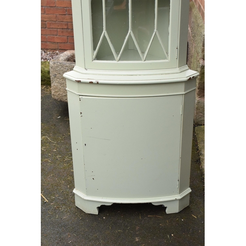 432 - A vintage wooden corner cabinet with glazed door with painted duck egg green decoration. 181cm tall.... 