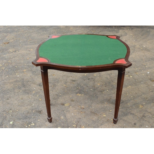 433 - A reproduction folding card table with green felt table and red leather insets. 80cm tall. 88cm when... 