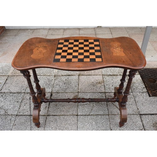 436 - Victorian walnut games table with inlaid decoration for a chessboard on turned supports. 89 x 44 x 7... 