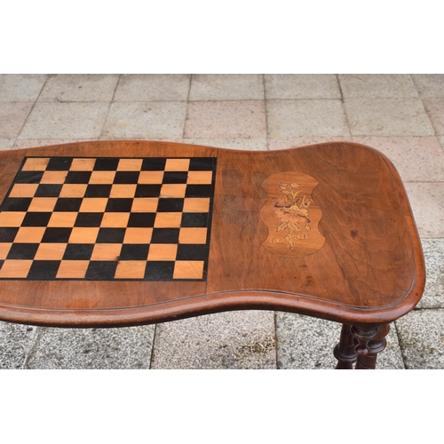 436 - Victorian walnut games table with inlaid decoration for a chessboard on turned supports. 89 x 44 x 7... 