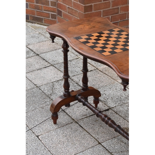 436 - Victorian walnut games table with inlaid decoration for a chessboard on turned supports. 89 x 44 x 7... 