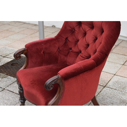 437 - A Victorian mahogany upholstered library chair. 92cm tall. In good condition.