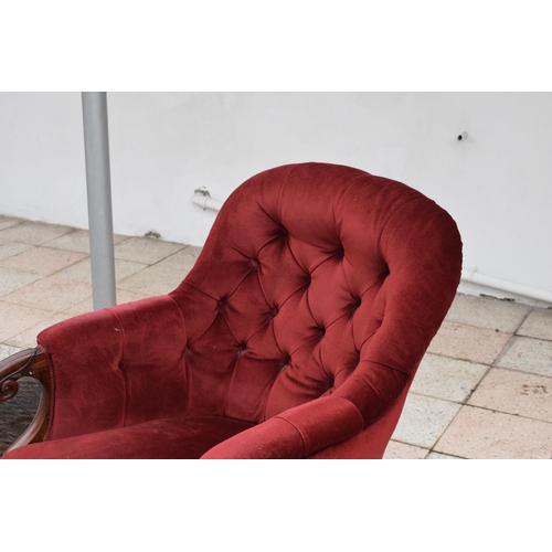 437 - A Victorian mahogany upholstered library chair. 92cm tall. In good condition.