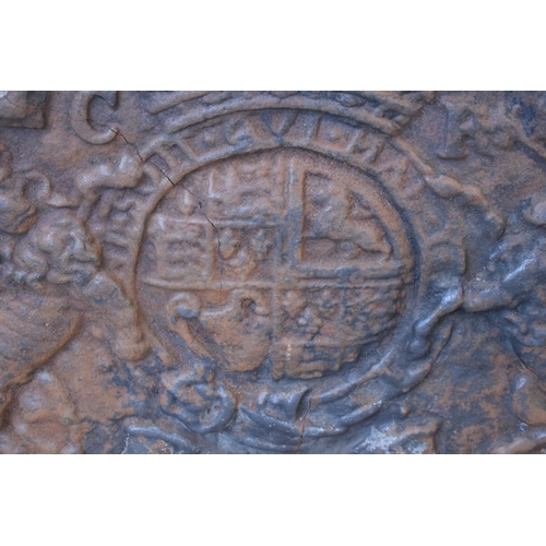 439 - A large antique cast iron domed fireback depicting the coat of arms of Charles I. Approx 100 x 79 x ... 