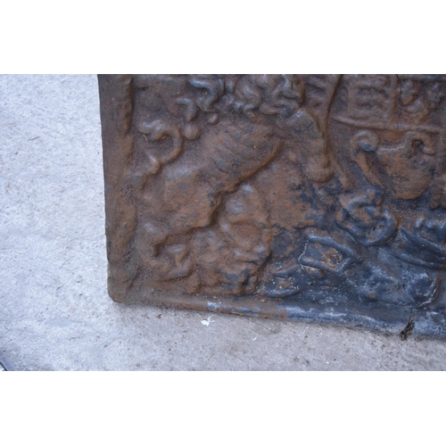 439 - A large antique cast iron domed fireback depicting the coat of arms of Charles I. Approx 100 x 79 x ... 