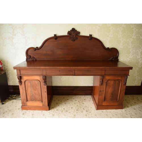 247C - 19th century figured mahogany twin pedestal buffet sideboard with raised back with carved detail. 21... 