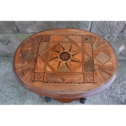 247E - An early 20th century sewing table with marquetry decoration in the Aesthetic Movement style with re... 