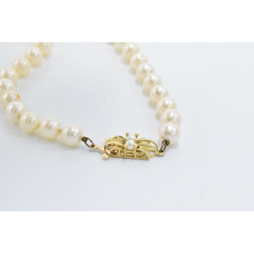 496 - A cased set of single-string cultured pearls with a 9ct gold clasp. Approx 50cm long.