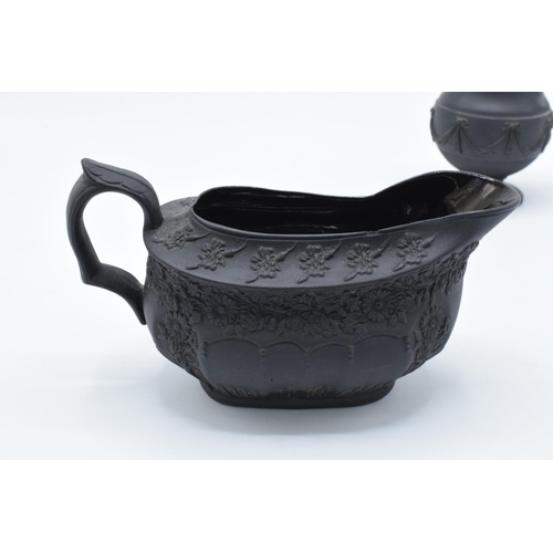 100 - A pair of early 19th century basalt milk jugs, circa 1800 to include one of globular form on a pedes... 