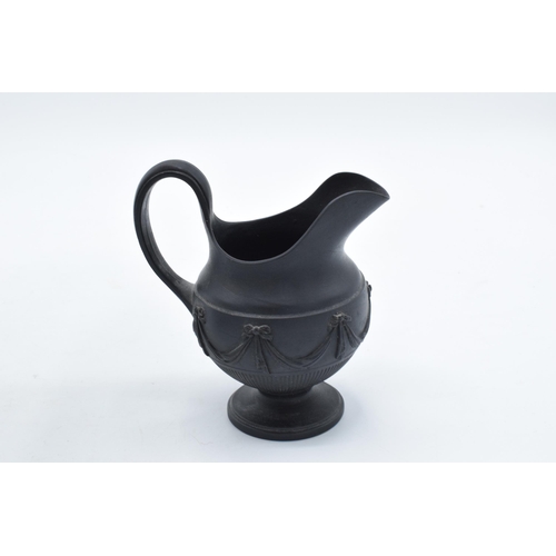 100 - A pair of early 19th century basalt milk jugs, circa 1800 to include one of globular form on a pedes... 