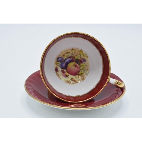 104 - Aynsley cup and saucer (duo) with Orchard Gold fruit style design on red and gilt background (2).