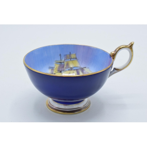 107 - Aynsley Fine Bone China tea cup decorated with a sailing ship / galleon at sea on blue background.