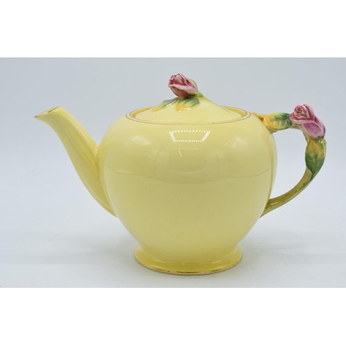 109A - Royal Winton rose bud yellow teapot with pink rose finial to lid. 15cm tall.