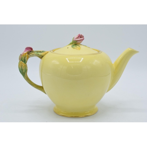 109A - Royal Winton rose bud yellow teapot with pink rose finial to lid. 15cm tall.