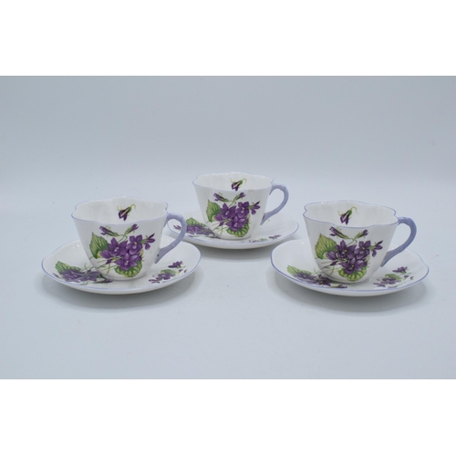 110 - A trio of Shelley duos 'Violets' pattern 13821 to include 3 cups and 3 saucers (6).