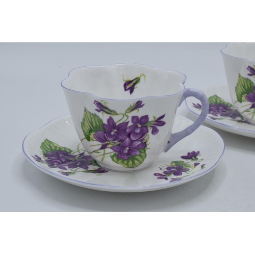 110 - A trio of Shelley duos 'Violets' pattern 13821 to include 3 cups and 3 saucers (6).