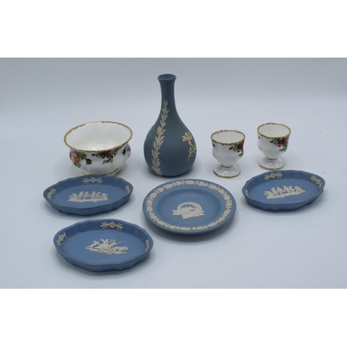 111 - A collection of pottery to include Wedgwood blue Jasperware to include a bud vase, an Alton Towers p... 