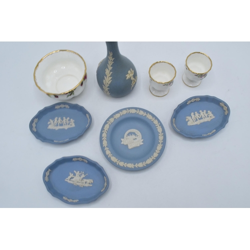 111 - A collection of pottery to include Wedgwood blue Jasperware to include a bud vase, an Alton Towers p... 