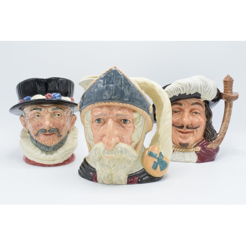 115 - A trio of large Royal Doulton character jugs to include Don Quixote D6455, Porthos D6440 and Beefeat... 