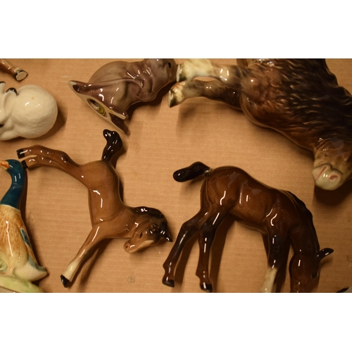 125 - A mixed collection of Beswick animals to include horses, a duck, a mouse, a Beatrix Potter figure et... 