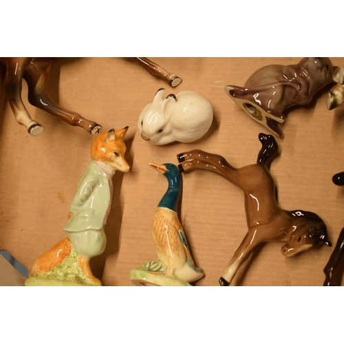 125 - A mixed collection of Beswick animals to include horses, a duck, a mouse, a Beatrix Potter figure et... 