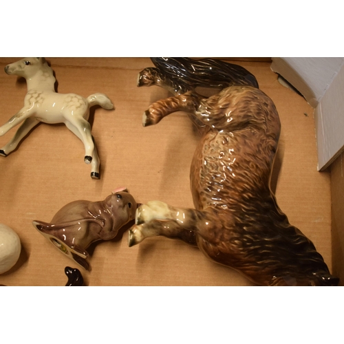 125 - A mixed collection of Beswick animals to include horses, a duck, a mouse, a Beatrix Potter figure et... 