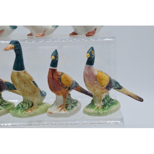 126 - A collection of Beswick birds to include mallards and pheasants with curled tails (8).