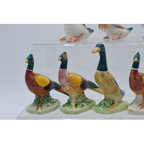 126 - A collection of Beswick birds to include mallards and pheasants with curled tails (8).