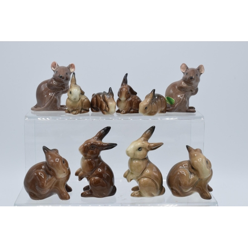 127 - A collection of Beswick animals to include rabbit families and two mice (10).