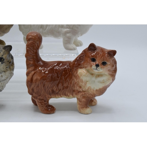 131 - A collection of Beswick 1898 cats in a grey colourway together with white, ginger and matte grey exa... 