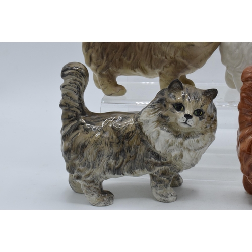 131 - A collection of Beswick 1898 cats in a grey colourway together with white, ginger and matte grey exa... 