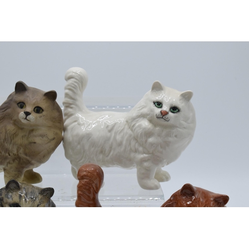 131 - A collection of Beswick 1898 cats in a grey colourway together with white, ginger and matte grey exa... 