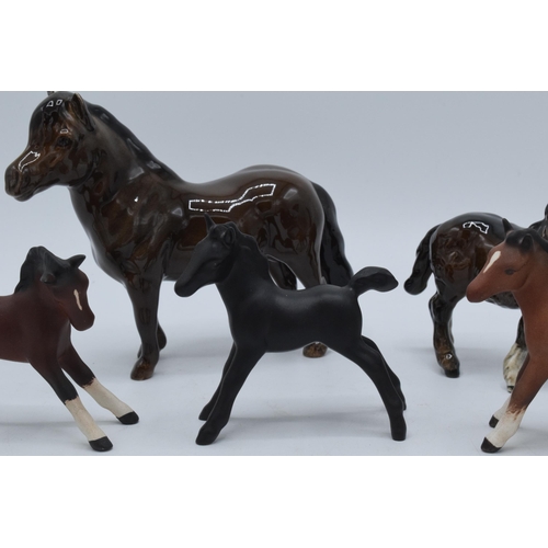 135 - A collection of small Beswick foals and horses to include Shetland pony, another Shetland, matte bla... 