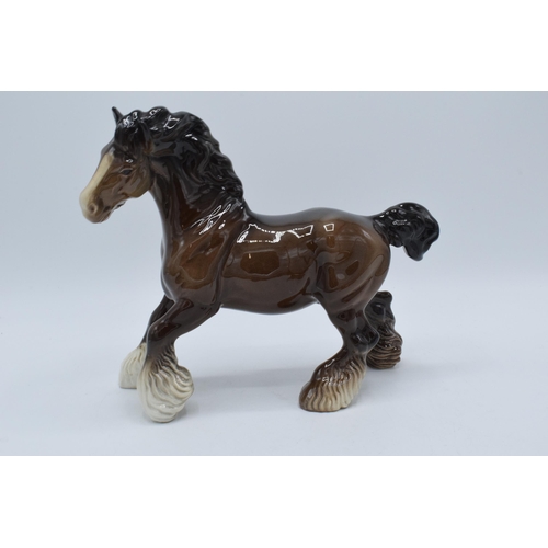 139 - Beswick brown cantering shire horse 975 together with brown lying foal 915 (2).