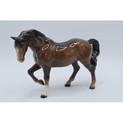 141 - A pair of Beswick stocky jogging mare horses in a brown colourway and a palomino colourway (2).