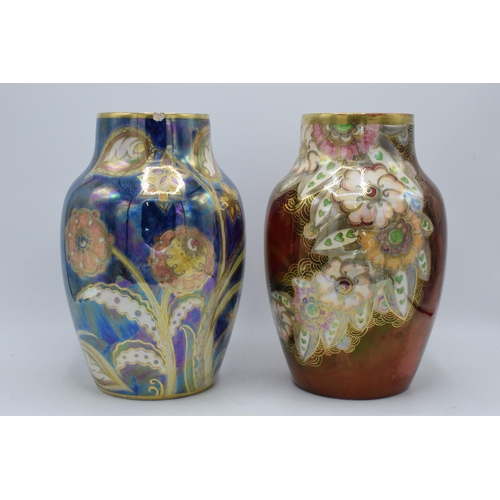 173 - A pair of Royal Winton bulbous lustre vase both with floral designs on a blue and red background (2)... 